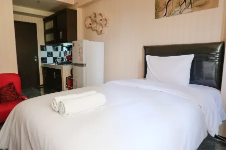 Homey and Cozy Studio Room at Suites @Metro Apartment