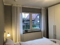 Spacious, bright apartment with 2 bedrooms and south-facing balcony Hoteles en Juist