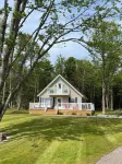 Cozy cabin style cottage tucked into the woods with a view of the water. Hotels near Howards Cove Lighthouse