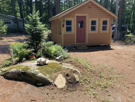 Famous cottage directly on 100' private shoreline of pristine lake.