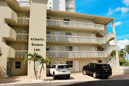 BEACHFRONT COMPLEX! STEPS FROM THE OCEAN!  HEATED POOL FULL KITCHEN FREE PARKING