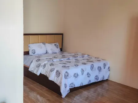 New Era Family Homestay Binjai Mitra RedDoorz Отели в г. Бинджай