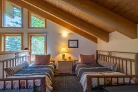 Ski bus stops at front door, court sports and indoor game room, bike path