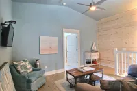 In-town coastal getaway, with a heated pool & level 2 Tesla EV charger on site.