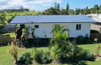 Indoor/outdoor pet-friendly beach house next to world-class beach and river.