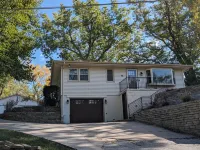 Cheerful two bedroom home in quiet neighborhood. Sun Porch ~ Patio ~  Large yard