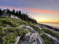 Sunrise Cottage. Relaxing waterfront deck on the rocky shore of Bailey Island.