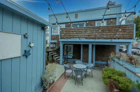 Across quiet street from sandy beach.