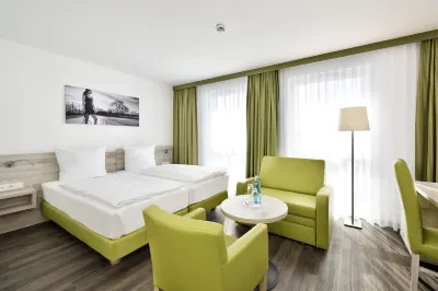 Novina Sleep Inn Herzogenaurach Отели рядом с достопримечательностью «Stammhaus Dassler»