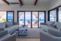 Brand New 12 Suite Villa  directly on the waters edge of the Caribbean Sea