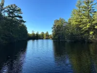 BEAUTIFUL lake front home with a private beach, dock and large yard