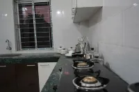 Azure Escape: Stylish 2-Bedroom Retreat in Guwahati with WiFi & AC Comforts