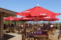 Peek of the ocean King size bed just Steps from the Beach