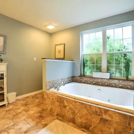 Hot Tub & Wooded Views: Lakefront Blue Eye Cottage