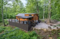 The Mighty Acorn, Bungalow is a delightful cozy tiny home in the woods.