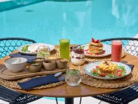 Adorno Beach Hotel and Suites Отели рядом с достопримечательностью «Пляж Орнос»