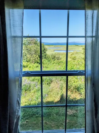 Cozy two bedroom home with ocean view. Quiet and secluded location.