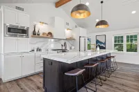 Custom Home with Lake Views + Cozy Fireplace