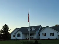 Fully custom modern four bedroom home on 13 acres with a stocked pond.