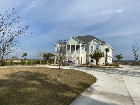 2 BEDROOM SUITE (SEPARATE FROM MAIN HOUSE) POOL, MARSH, GOLF AND WATER VIEWS