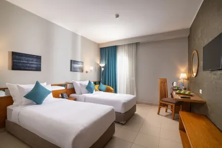 Dhara Residence E2 Lodge Hotel Отели рядом с достопримечательностью «Университет Октобер 6»