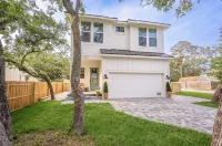 BRAND NEW 4-bedroom, 2 primary suites, heated pool, steps to the beach and river