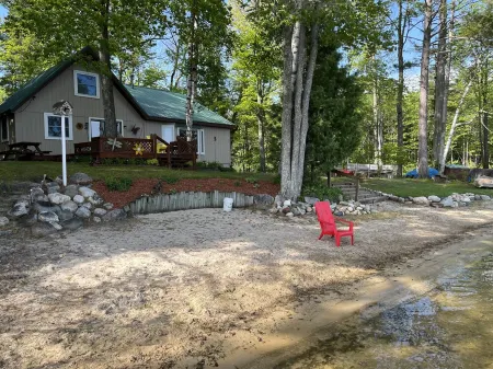 Wonderful house on sandy beach, sports lake close to golf, bike/snowmobile trail