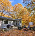Stylish, dog-friendly retreat with a firepit, golf cart, & beach access
