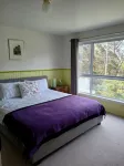 cosy cottage with wood heater, surrounded by bushland