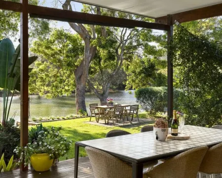 A delightful riverside house -comfortable and stylish - in Urunga