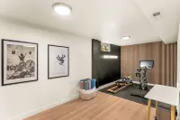 Modern Retreat w/ Hot Tub, Peloton, Gym, and BBQ