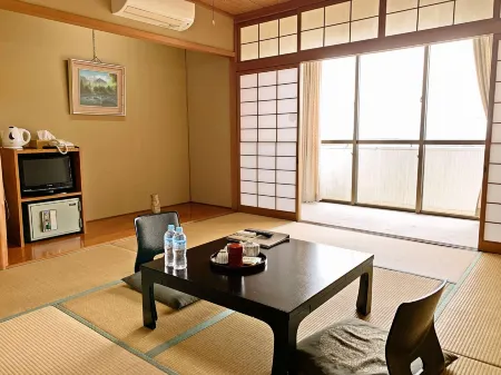 Hamasaka Onsen Totoya Отели в г. Синъонсен