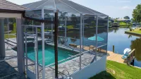 Five Star 3Bd Waterfront Canal Home w/ Private Pool/Spa & Boat Dock.