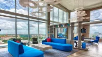 Downtown Luxury High-Rise Retreat: Panoramic City Views & Modern Amenities