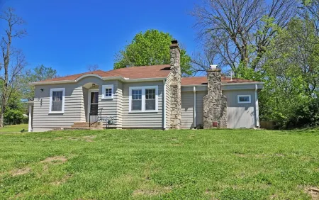 Charming 2-bedroom cottage in scenic Southwest MO with a large corner lot.