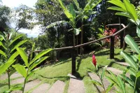 Beautiful, spacious house with 4 bedrooms, veranda with hammocks, garden. Hotels in Barra do Sahy