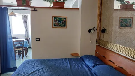 THE MERIDIANA APARTMENT ON THE SEA WITH PRIVATE BEACH SDRAIO AND UMBRELLA