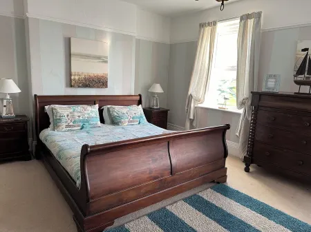 Pendragon House Overlooks Crooklets Beach in Bude with parking for 5 cars.