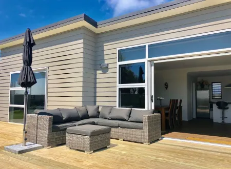 Brand New 3 Bedroom Beachfront Getaway.  Beach just across the road.