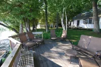 Torch Lake Exceptional Lakefront Cottage and Guest House - with Sandy Beach