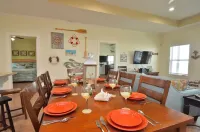 Just steps to the Sand & Surf!  Sleeps 12, with 2 Master Suites! Perfect Rental!