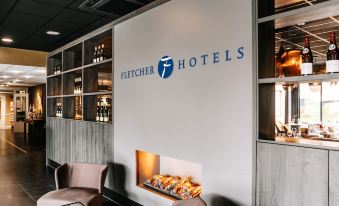 "a modern restaurant interior with a fireplace , multiple chairs , and a sign for "" fletcher hotels "" on the wall" at Fletcher Hotel-Restaurant Zevenbergen-Moerdijk