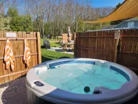 Private Hot Tub, Outdoor TV, near Downtown & Lake Michigan Beaches! Hotels in Filer Charter Township