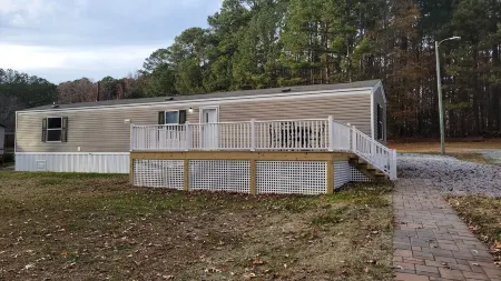 Waterfront mobile home on beautiful Lake Gaston with private pier access.