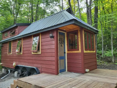 Tiny bungalow secluded in the woods with lake view.  Pets accepted!