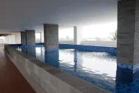 Simple and Cozy Living Studio Room at Poris 88 Apartment - Bãi đậu xe