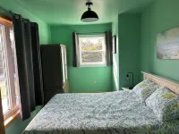 Close to Beach and Town of Souris. Quaint cottage with lovely log cabin feel. Hotels in Kings County