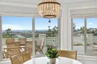 Enjoy the Sunset and Ocean Views in this Designer Vacation Home with Privacy.