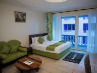 Cowrie Shell Beach Apartments Official Hotels near Nguuni Wildlife Sanctuary