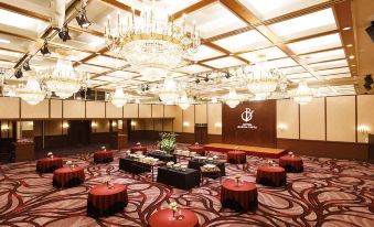 a large , elegant dining room with multiple round tables and chairs arranged for a formal event at Hotel Buena Vista